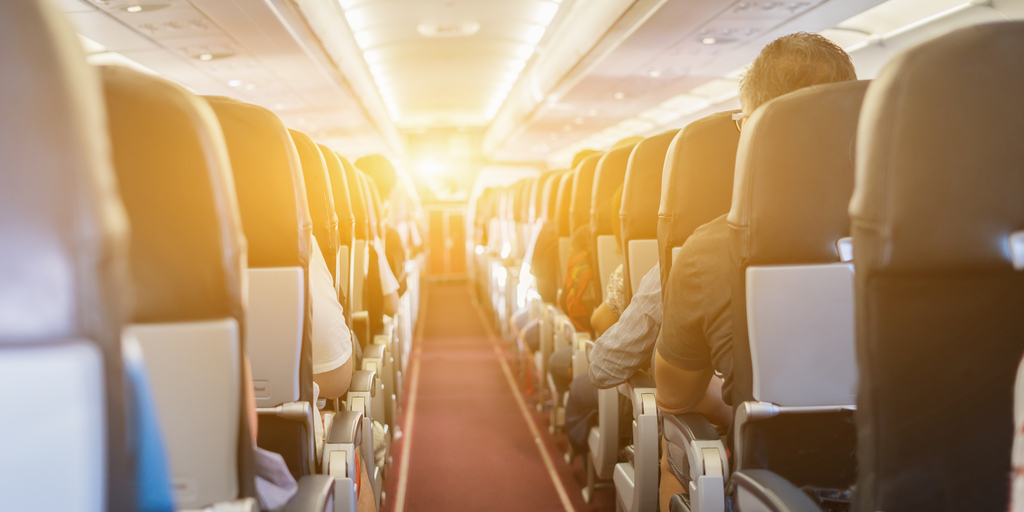inside of an airplane with passengers